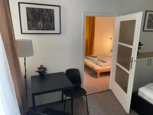 Postel nebo postele na pokoji v ubytování Black Style ROOMS Moravske namesti