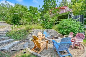 a group of chairs sitting around a fire pit at Smith Mountain Lake Cottage with Dock and Fire Pit! in Gladehill