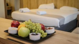 a tray of fruit on a table in a hotel room at Sandy palace Hotel in Amman