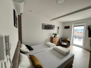 Ένα ή περισσότερα κρεβάτια σε δωμάτιο στο Best Apartments