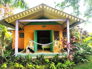 a house with a hammock in front of it at Fata Morgana Eco Hotel in Las Terrenas