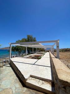 a pavilion on the beach near the water at Villa Aristoteles in Halki