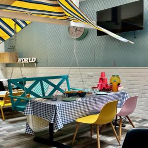a dining room with a table and chairs at trendy hostel in Ivry-sur-Seine