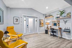 a living room with yellow chairs and a desk at Zen Retreat - Sauna Pool Cold Plunge & More in Fort Lauderdale +43 photos