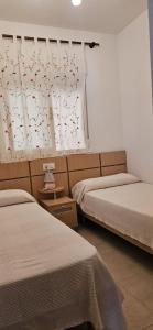 Postel nebo postele na pokoji v ubytování Apartamento acogedor en Magic World, Torre la Sal + 37 fotografií