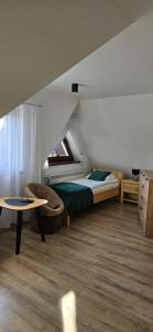 Posteľ alebo postele v izbe v ubytovaní DW Basia pokoje i apartament