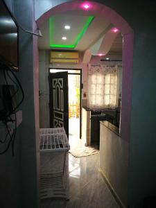 a hallway with a green light in a room at STUDIO Jijel in Jijel