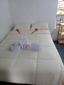 Postel nebo postele na pokoji v ubytování kaypi rosas wasi Amantani + 7 fotografií
