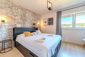 Postel nebo postele na pokoji v ubytování Apartments Šime
