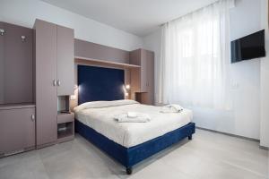 Postel nebo postele na pokoji v ubytování Hotel Niagara