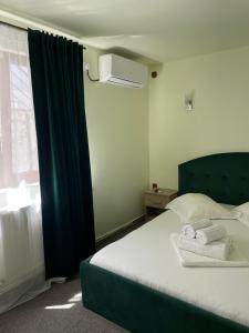 Postel nebo postele na pokoji v ubytování Vila Anir