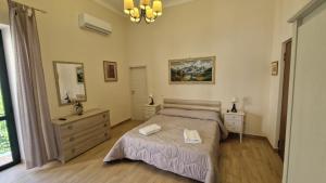 A bed or beds in a room at B&B IL CEDRO