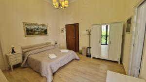A bed or beds in a room at B&B IL CEDRO