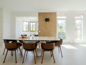 a dining room with a table and chairs at Holiday Home Villa Deauville by Interhome in Deauville