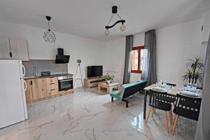 a living room with a couch and a table at Village Villa, Agios Georgios Grevena in Grevena
