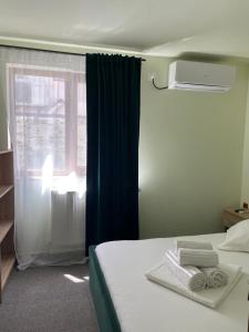 Postel nebo postele na pokoji v ubytování Vila Anir
