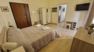 A bed or beds in a room at B&B IL CEDRO