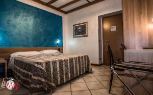 Postel nebo postele na pokoji v ubytování Hotel Bel Sit