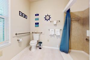 a bathroom with a toilet and a shower at Windy Harbor House in Wilmington +18 photos