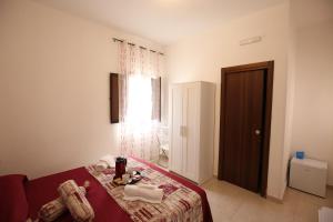 A bed or beds in a room at La Corte Dei Naviganti