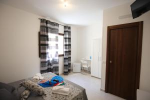 A bed or beds in a room at La Corte Dei Naviganti