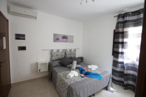 A bed or beds in a room at La Corte Dei Naviganti