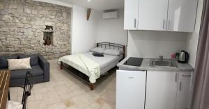 Kuchyňa alebo kuchynka v ubytovaní Apartman Pundinica