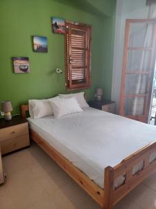 Postel nebo postele na pokoji v ubytování Golden vacations at Pefkohori 2