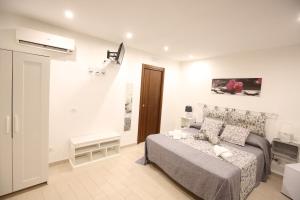 A bed or beds in a room at La Corte Dei Naviganti