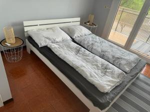 Postel nebo postele na pokoji v ubytování Aprillia Marittima