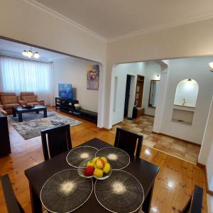 a living room with a table with fruit on it at La Casa di Sofia in Sofia