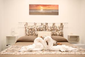 A bed or beds in a room at La Corte Dei Naviganti