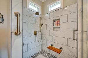 a bathroom with a shower with a glass door at On-Site Lake with Boat Ramp Greenwood Retreat! in Greenwood +18 photos