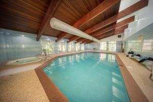 a large indoor swimming pool in a house at Beaver Village Unit #0621 in Winter Park