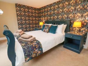 Ένα ή περισσότερα κρεβάτια σε δωμάτιο στο Seascape Cottage