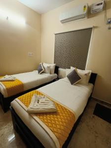 Postel nebo postele na pokoji v ubytování Neighbour Inn - Apart Hotel