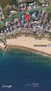 a map of a beach next to the water at T1 na 1 linha da Praia da Rocha in Portimão