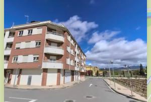 a tall brick building on the side of a street at Casa Cristina - Rioja II in Cenicero