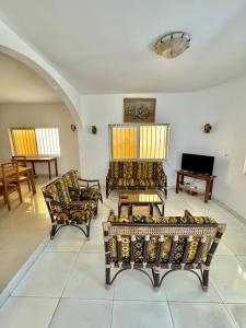 Posezení v ubytování Guesthouse Cocotiers Cotonou