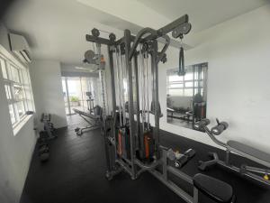 a gym with a bunch of equipment in a room at Secret Passage in Uswetakeiyawa