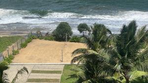 an aerial view of a beach with the ocean at Secret Passage in Uswetakeiyawa