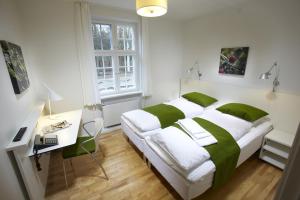 Postel nebo postele na pokoji v ubytování Skarrildhus Sinatur Hotel & Konference + 37 fotografií
