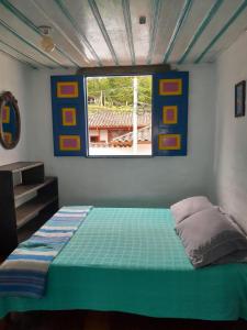 Postel nebo postele na pokoji v ubytování Hostal Familiar Jerico