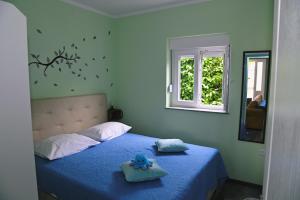 Postel nebo postele na pokoji v ubytování Apartments Biondi