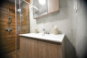 a bathroom with a sink and a shower at Chrysa in Alexandroupoli