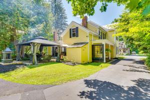a yellow house with a gazebo in the yard at 6 Mi to Lake George Adirondack Home with Game Room in Warrensburg