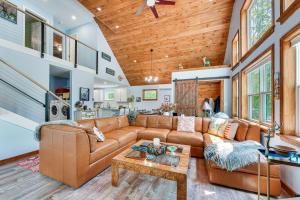 a living room with a couch and a table at Near Hiking Trails and Ski Resorts Killington Home! in Killington