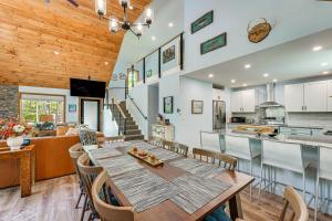 a dining room and kitchen with a table and chairs at Near Hiking Trails and Ski Resorts Killington Home! in Killington