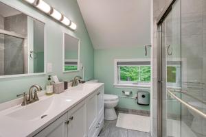 a bathroom with a sink and a toilet and a shower at Near Hiking Trails and Ski Resorts Killington Home! in Killington +23 photos