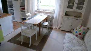 a kitchen with a table and chairs and a couch at Ferienwohnung Wolfshagen in Wolfshagen